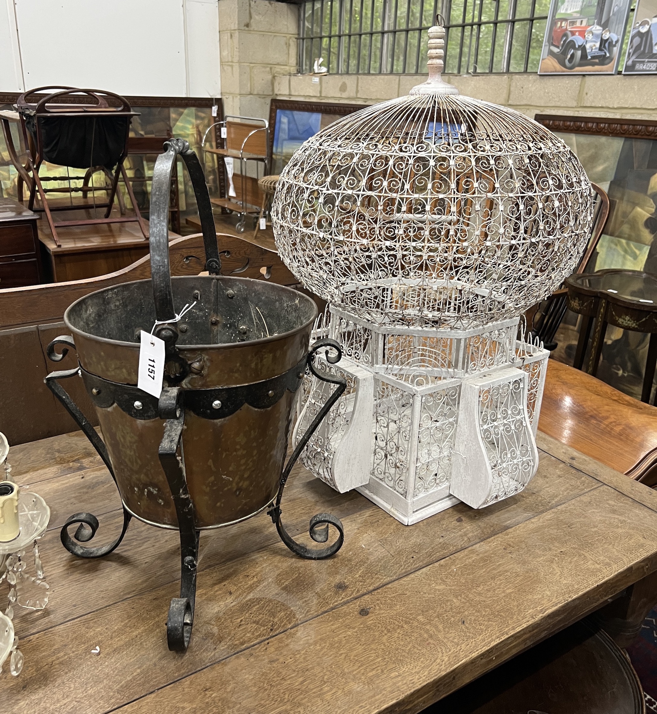 An early 20th century copper and wrought iron coal bucket, height 60cm, together with a wirework birdcage